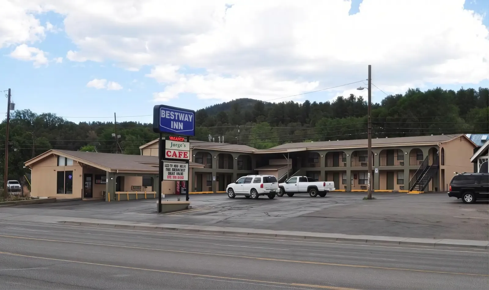 Bestway Inn exterior and on-site parking along Highway 70